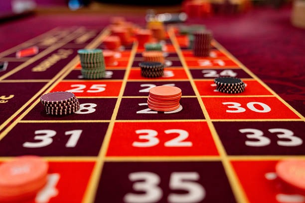 Mobile phone displaying sadewa777 platform with live casino interface and game selection